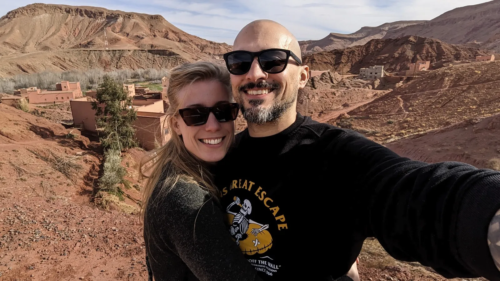 Anne and David smiling in the mountains during their desert trip.