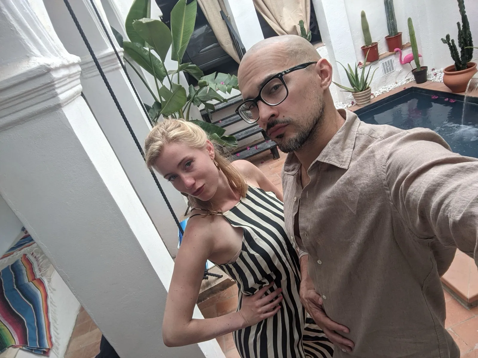 Anne and David posing in a courtyard before going out.